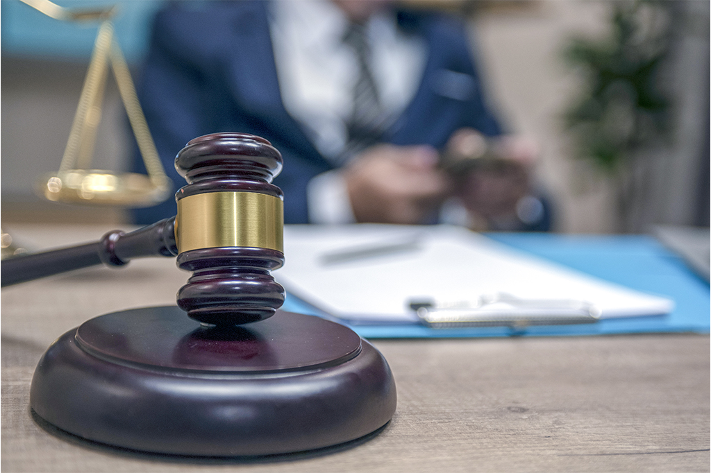 wooden gavel in law office